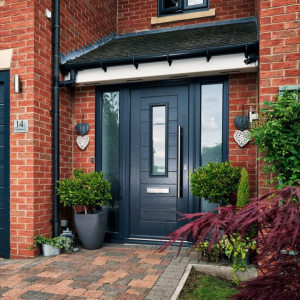 double glazing christchurch composite door with grey panel effect and plants outside